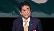 Japan's Prime Minister Shinzo Abe delivers a speech to demand the return of the Northern Territories, a group of islands held by Russia, at a national rally in Tokyo on February 7, 2019.  / AFP / Kazuhiro NOGI