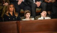First lady Melania Trump (L) with Grace Eline and Joshua Trump, special guests of President Donald Trump, attend the State of the Union address at the US Capitol on February 5, 2019.  AFP / Mandel Ngan