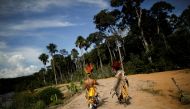 Indigenous people of the Pareci community walk in the village of Wazare near the town of Campo Novo do Parecis, Brazil, April 26, 2018. Reuters/Ueslei Marcelino