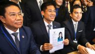 Thai Raksa Chart party leader Preechapol Pongpanich, holds up application of candidate for Prime Minister, Thailand's Princess Ubolratana Rajakanya Sirivadhana Barnavadi, at the election commission office in Bangkok, February 8, 2019. Reuters/Athit Perawo