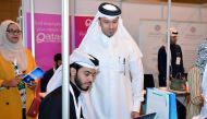 The officials are seen at the Education City Career Fair.