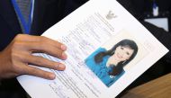 Thai Raksa Chart party leader Preechapol Pongpanich, holds up application of candidate for Prime Minister, Thailand's Princess Ubolratana Rajakanya Sirivadhana Barnavadi, at the election commission office in Bangkok, Thailand February 8, 2019. REUTERS/Ath