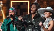 (L-R) Host US singer-songwriter Alicia Keys, former US First Lady Michelle Obama and US singer Jennifer Lopez speak on stage during the 61st Annual Grammy Awards on February 10, 2019, in Los Angeles. / AFP / Robyn Beck