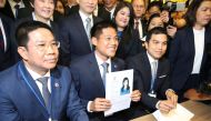 File photo of Thai Raksa Chart party leader Preechapol Pongpanich, holds up application of candidate for Prime Minister, Thailand's Princess Ubolratana Rajakanya Sirivadhana Barnavadi, at the election commission office in Bangkok, Thailand February 8, 201