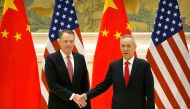 US Trade Representative Robert Lighthizer (L) and Chinese Vice Premier and lead trade negotiator Liu He shake hands as they pose for a photo before the opening session of trade negotiations at the Diaoyutai State Guesthouse in Beijing on February 14, 2019