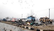 Indian soldiers examine the debris after an explosion in Lethpora in south Kashmir's Pulwama district February 14, 2019. Reuters/Younis Khaliq