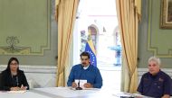 This handout picture released by the Venezuelan presidency shows Venezuelan President Nicolas Maduro (C) speaking next to Vice President Delcy Rodriguez (L) and Agriculture Minister Wilmar Catro Soteldo (R) during a television programme in Caracas on Febr