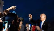 US President Donald Trump is greeted by supporters upon his arrival in West Palm Beach, Florida, on February 15, 2019. / AFP / Jim WATSON