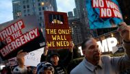 People gather to protest against U.S. President Donald Trump's declaration of a national emergency to build a border wall, at Trump International Hotel & Tower in Manhattan, New York, U.S. February 15, 2019. REUTERS/Andrew Kelly