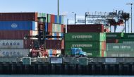 (FILES) In this file photo taken on February 16, 2019, shipping containers from China and other nations are unloaded at the Long Beach Port in Los Angeles, California. AFP / Mark Ralston 