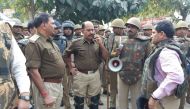 (FILES) In this file photo taken on December 3, 2018, policemen gather outside a police station following reports of mob violence at Chingravati village in Bulandhahr, India's northern Uttar Pradesh state. AFP 