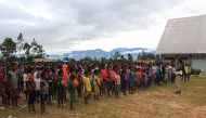 This picture taken on February 12, 2019 shows Papuan children gathering at a temporary shelter in Wamena, Indonesia's Papua province. AFP / ANYONG
