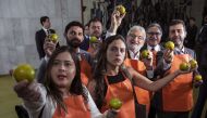 Opposition members of the Brazilian congress stage a protest at the National Congress in Brasilia while Brazil's President Jair Bolsonaro arrives to hand over a draft of a pension reform bill on February 20, 2019.  AFP / Sergio Lima