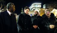 Canada's Prime Minister Justin Trudeau speaks with members of the Nova Scotia Muslim community while in attendance for a vigil in support of a Syrian refugee family who lost seven children killed in a house fire in the community of Spryfield earlier in th