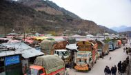 In this picture taken on February 20, 2019, goods trucks are pictured at the border town of Chakothi in Pakistan-administered Kashmir, some 3 km from Line of Control (LoC).  AFP / Sajjad Qayyum