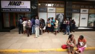 People queue outside a bank in Harare, Zimbabwe February 22, 2019. Reuters/Mike Hutchings 