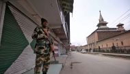 Indian Central Reserve Police Force (CRPF) personnel stands guard in front of closed shops next to the Jamai Masjid in Srinagar February 23, 2019. REUTERS/Danish Ismail