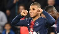 Paris Saint-Germain's French forward Kylian Mbappe celebrates scoring his team's third goal during the French L1 football match between Paris Saint-Germain and Nimes at the Parc de Princes in Paris on 23 February 2019. / AFP / FRANCK FIFE
