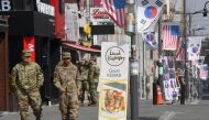 This picture taken on February 21, 2019 shows US soldiers walking at a shopping zone outside the US Camp Humphreys in Pyeongtaek. AFP / Jung Yeon-je 