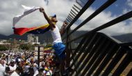Supporters of Venezuelan opposition leader Juan Guaido take part in a march in Caracas, on February 23, 2019. AFP / Cristian Hernandez 