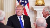 US President Donald Trump greets attendees after addressing the 2019 White House business session with governors in the State Dining Room of the White House in Washington, DC on February 25, 2019. / AFP / MANDEL NGAN