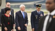 US Vice President Mike Pence (C) is welcomed by Colombia's Foreign Affairs Vice Minister Luz Stella Jara (L) and Colombia's Air Force General Luis Carlos Cordoba, upon arrival in Bogota, on February 25, 2019.  AFP / JOAQUIN SARMIENTO