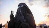 French-Tunisian Umm Yussef, 21, speaks to AFP during an interview, as she walks towards the Kurdish-led Syrian Democratic Forces (SDF) after leaving the IS group's last holdout of Baghouz, in Syria's northern Deir Ezzor province on February 22, 2019.  AFP