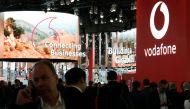 People visit the Vodafone stand at the Mobile World Congress (MWC) in Barcelona on February 25, 2019. AFP / Pau Barrena 