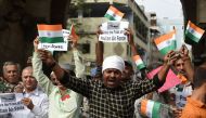 Indian Muslims shout anti-Pakistani slogans as they celebrate the Indian Air Force (IAF) strike launched on a Jaish-e-Mohammad (JeM) camp in Balakot, in Ahmedabad on February 26, 2019.  AFP / SAM PANTHAKY