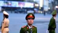 Vietnamese policemen guard the area near the Sofitel Legend Metropole hotel in Hanoi on February 27, 2019, ahead of the second US-North Korea summit. AFP / Ye Aung Thu 