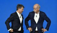 The CEO of German auto giant Daimler AG Dieter Zetsche (R) and CEO of German carmaker BMW Harald Krueger gesture after they presented the merger of their car sharing activities on February 22, 2019 in Berlin. AFP / John MACDOUGALL