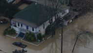 GUERNEVILLE, CALIFORNIA - FEBRUARY 27: People paddle a boat through a flooded neighborhood on February 27, 2019 in Guerneville, California. AFP 
