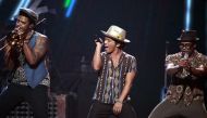 Bruno Mars (C) performs during the iHeartRadio Music Festival in Las Vegas, Nevada September 21, 2013. Reuters/Steve Marcus 