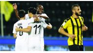 FROM LEFT: Al Sadd’s Ali Asad, Baghdad Bounedjah and Abdelkarim Hassan celebrate after beating Qatar SC 8-1, yesterday.