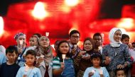 Family members hold candles during the fifth annual remembrance event for the missing Malaysia Airlines flight MH370, in Kuala Lumpur, Malaysia March 3, 2019. REUTERS/Lai Seng Sin