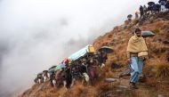 Pakistani Kashmiris carry the coffin of a civilian, who was killed in a gunfight between Indian and Pakistan troops on the Line of Control (LoC), at a funeral ceremony on the outskirts of Muzaffarabad, the capital of Pakistan-administered Kashmir on March