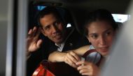 Venezuelan opposition leader Juan Guaido, who many nations have recognized as the country's rightful interim ruler, waves next to his wife Fabiana Rosales while leaving a hotel in Salinas, Ecuador March 3, 2019. REUTERS/Daniel Tapia