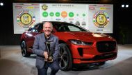 Jaguar design director Ian Callum poses next to a Jaguar I-Pace model car awarded European Car of the year 2019, ahead of the start of the Geneva International Motor Show 2019 on March 4, 2019 in Geneva. AFP / Fabrice Coffrini 