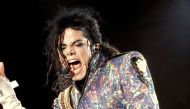 The artist Michael Jackson performing his song 