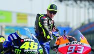 Yamaha MotoGP’s Valentino Rossi looks at his bike.