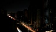 Car lights are seen on one of the main roads of the city during the second day of a blackout in Caracas, Venezuela March 9, 2019. REUTERS/Carlos Jasso
