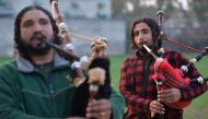 A Pakistani musical band perform with bagpipes made at the Mid East bagpipe factory in the eastern city of Sialkot on January 25, 2019. AFP / Aamir Qureshi 