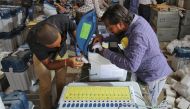 Election staff prepare Voter Verifiable Paper Audit Trail (VVPAT) machines and Electronic Voting Machines (EVM) ahead of India's general election at a warehouse in Ahmedabad, India, March 6, 2019. Reuters/Amit Dave