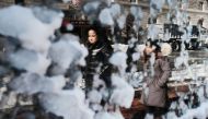People are reflected in a frozen window the morning after a massive winter storm on January 5, 2018 in Boston (Spencer Platt /Getty Images/AFP) 