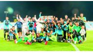 Al Wakra’s players and officials celebrate after securing their spot in the next season’s QNB Stars League.