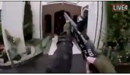 A still image taken from video circulated on social media, apparently taken by a gunman and posted online live as the attack unfolded, shows him entering a mosque in Christchurch, New Zealand, March 15, 2019. Social Media Website/Handout via REUTERS 