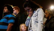 A woman reacts as she pays a tribute to victims of the mosque attacks outside Masjid Al Noor in Christchurch, New Zealand, March 16, 2019. REUTERS/Jorge Silva