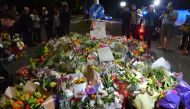 People lay flowers and notes to pay tribute at streets close to the Masjid Al Noor Mosque and Linwood Mosque, shooting area, in Christchurch, New Zealand on March 16, 2019. Recep ?akar - Anadolu