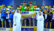 Marco (left) and Esteban Grimalt celebrate on the podium after winning the FIVB Beach Volleyball World Tour Katara Cup in Doha, yesterday.