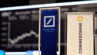 FILE PHOTO: Banners of Deutsche Bank and Commerzbank are pictured in front of the German share price index, DAX board, at the stock exchange in Frankfurt, Germany, September 30, 2016. REUTERS/Kai Pfaffenbach